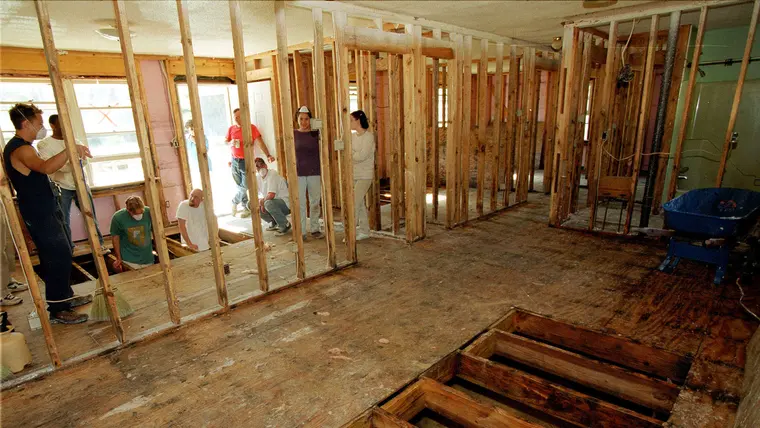 Walls opened to the framing so hidden water can dry
