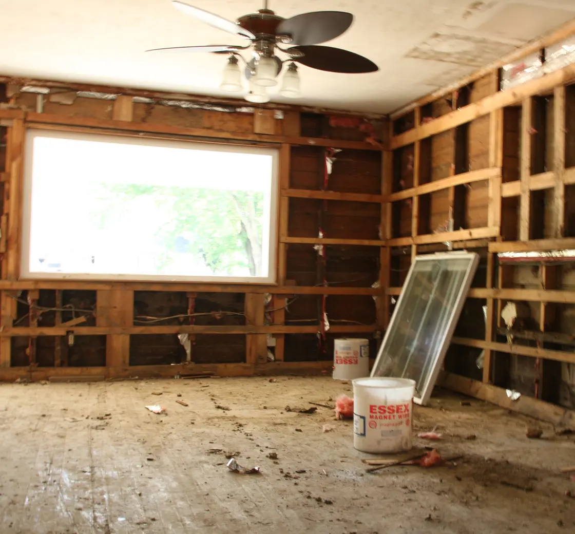 Water-damaged room opened up to dry the wall framing