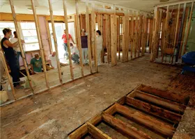 Room stripped to the wall framing, ready for new drywall