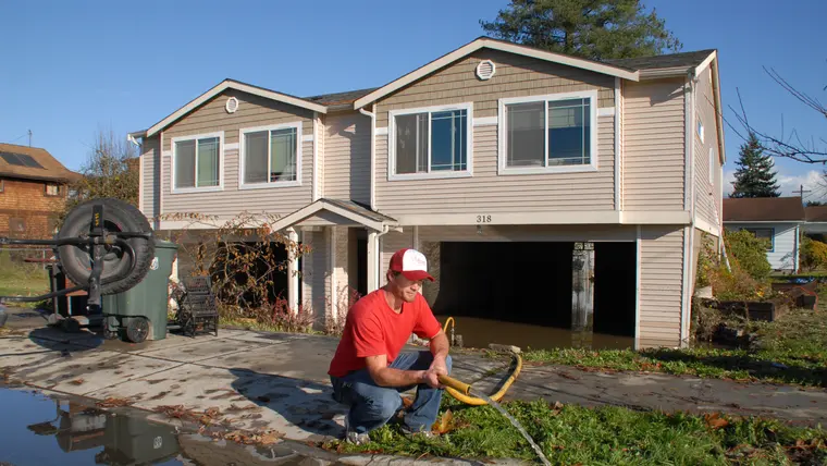 Pumping flood water out of a house