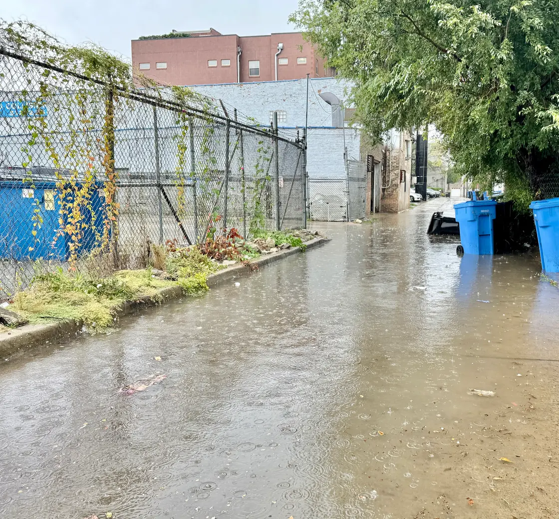 Storm water flooding a Chicago alley after heavy rain
